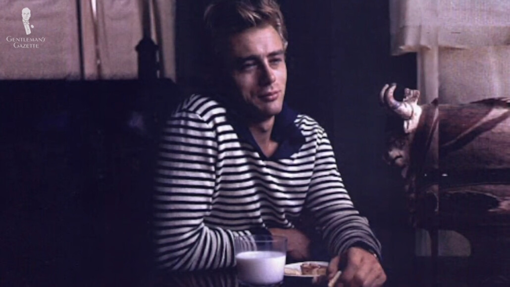 James Dean in a collared blue-and-white Breton shirt.