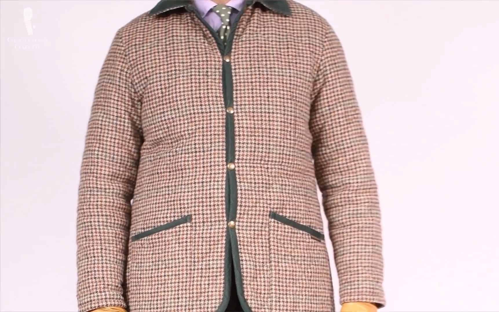 Raphael in his houndstooth-patterned Barbour quilted jacket