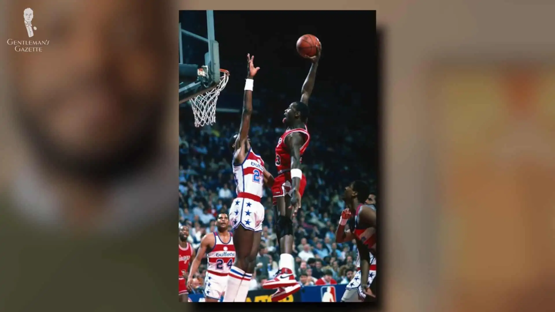 Another angle of the basketball game where Michael Jordan is wearing his Nike Air Jordans.