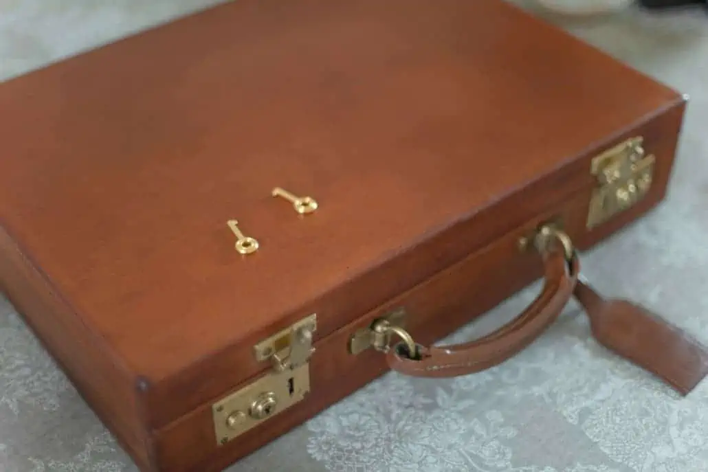 A brown attache case with key locks.