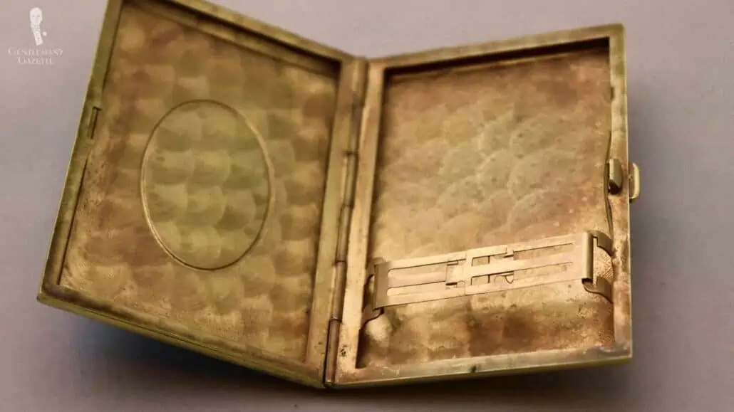 A cigarette case repurposed as a business cardholder.