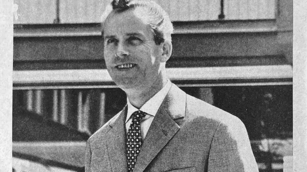 A gentleman in the 1960s wearing a suit.