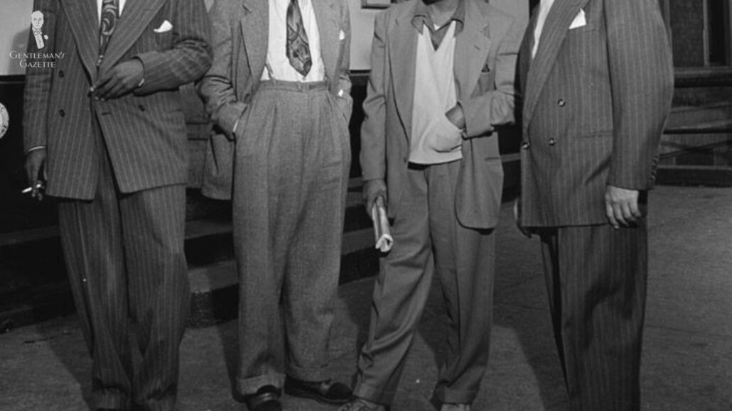 A group of men wearing trousers with wider openings which was famous in the 1940s.