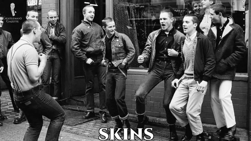 A group of young men with shaved heads wearing skins inspired outfits.