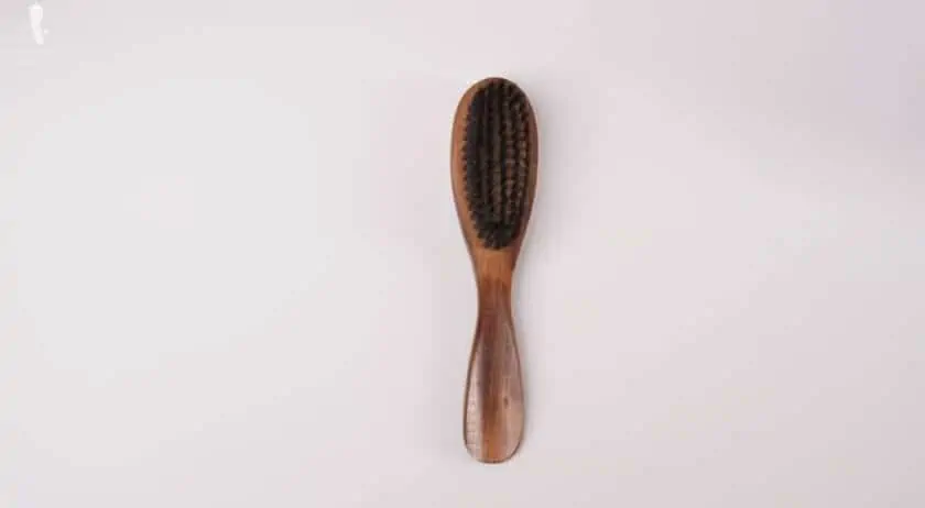 A two-in-one clothes brush and shoe horn.