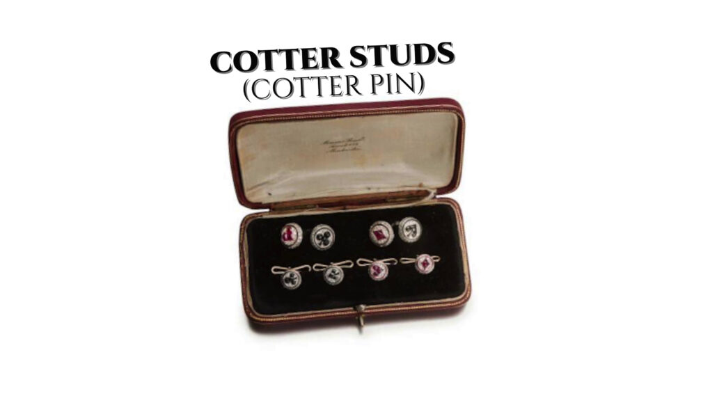 A vintage 1920s cards-themed set of cotter studs and cufflinks