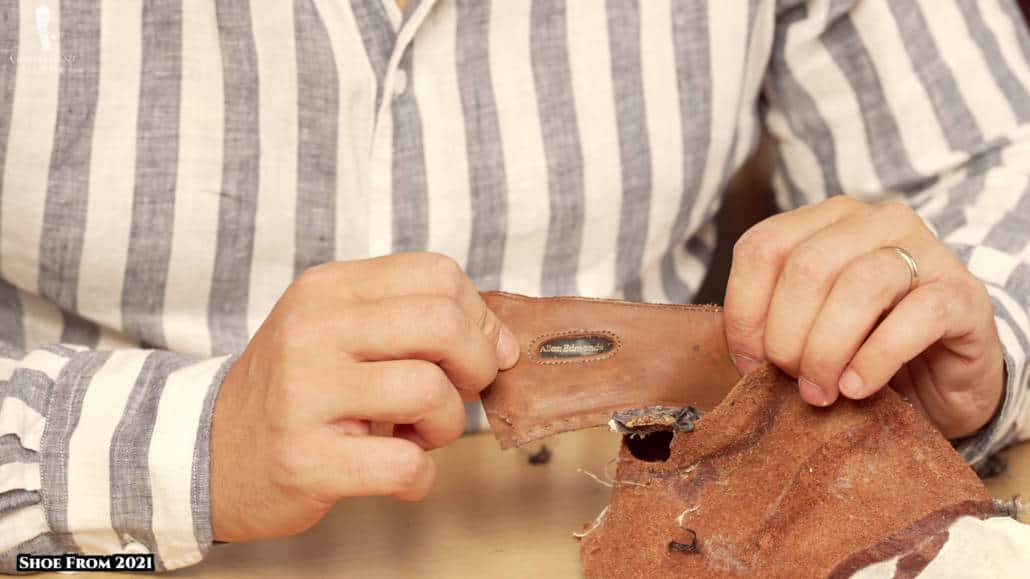 Allen Edmonds branding is sewn at the back part of the shoe