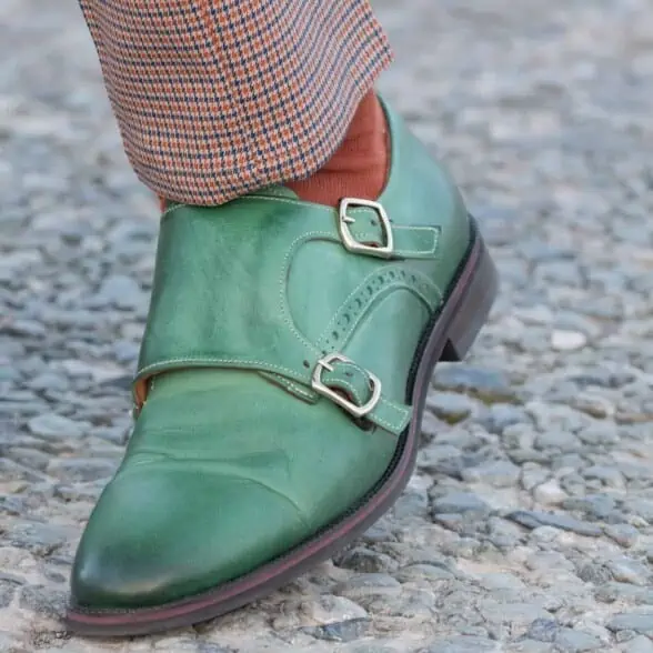 Green double monk strap with orange socks and pepita trousers