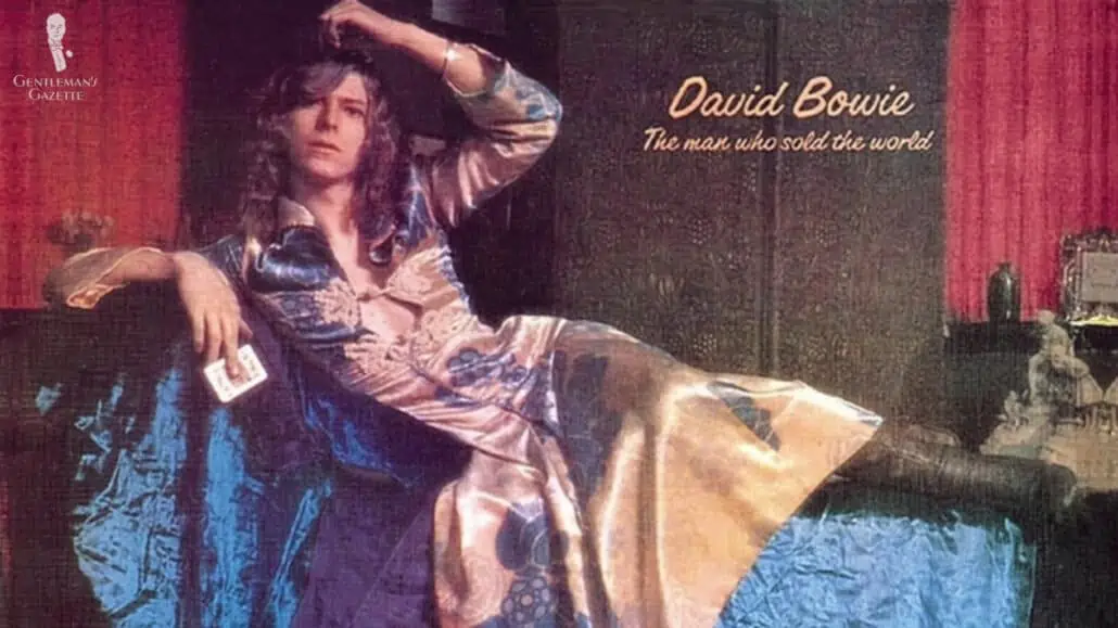David Bowie wearing a golden floral dress.