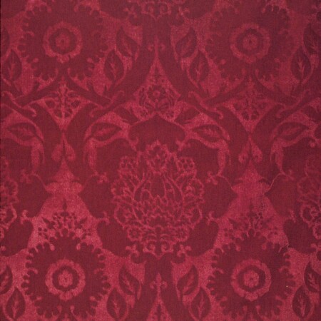 A swatch of red velvet with an embossed image
