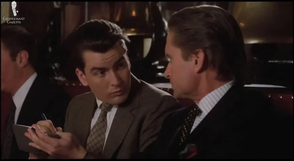 Fox in a similar ill-fitting taupe suit as Gekko with a checked tie