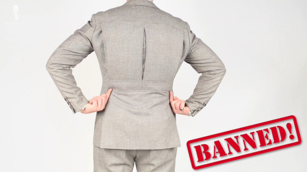 Jackets with pleated and/or belted backs were banned in Britain during WWII.