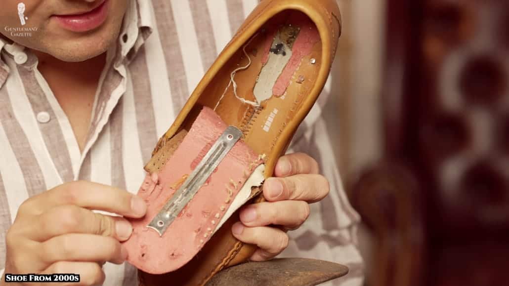 The material surrounding this metal shank is compressed/composite leather.