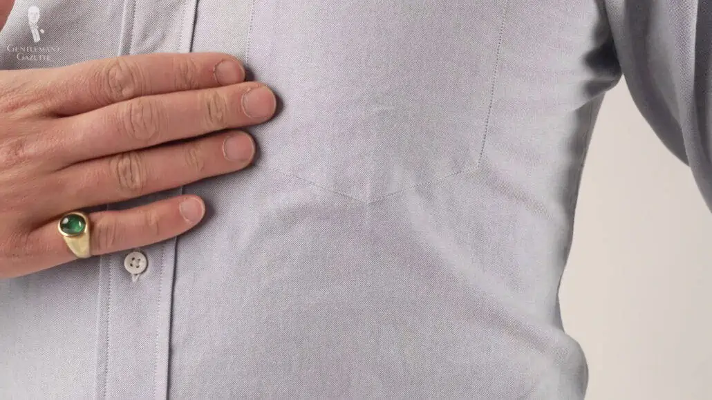Raphael assesses the texture of a Spier & Mackay OCBD shirt.