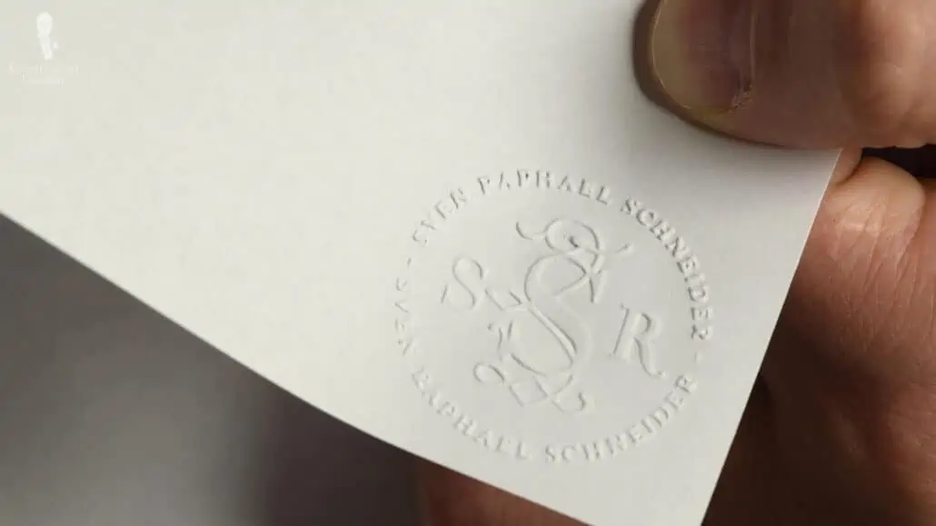 Raphael's customized stationery with an embossed monogram.