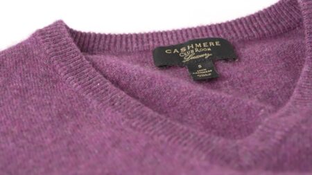 Preston’s berry-colored V-neck “budget” cashmere sweater from Club Room.