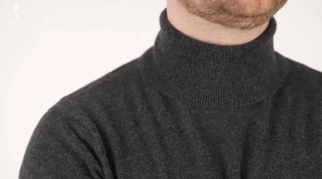 Nathan’s charcoal-colored turtleneck “budget” cashmere sweater from Uniqlo.