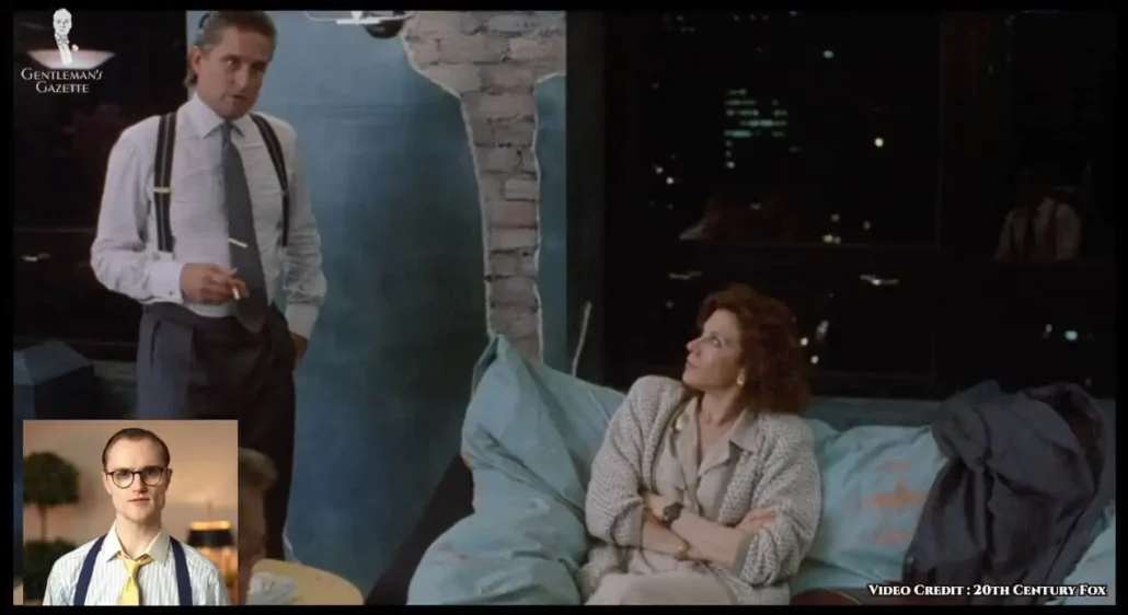 Gekko in a gray and white horizontally striped shirt.