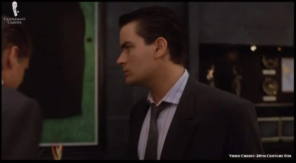 Fox wearing a silk tie in blue and green tones.