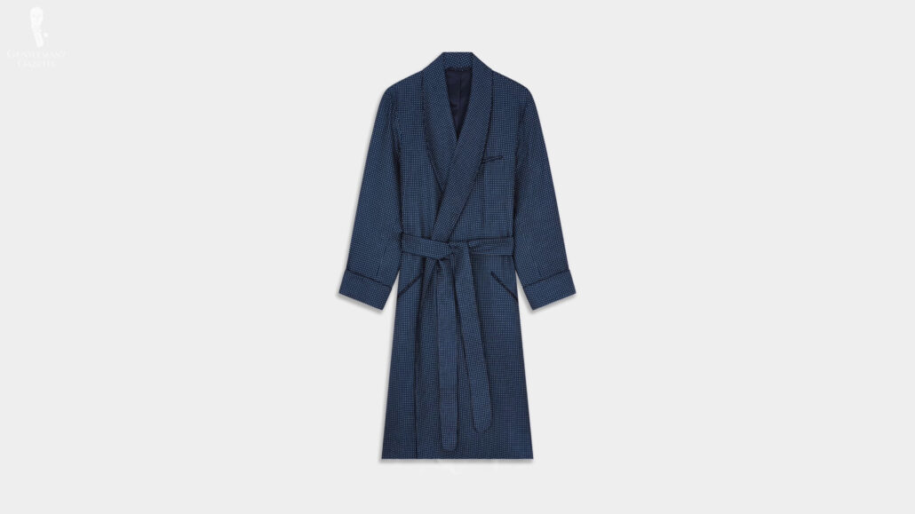 A navy piped silk spot-patterned dressing gown featuring angled jetted pockets