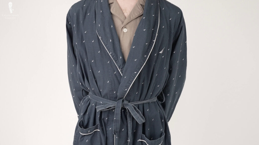 A simpler navy cotton dressing gown with sailboat patterns