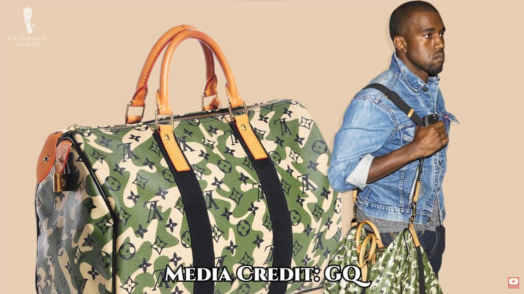 Kanye West carrying an LV duffel bag.