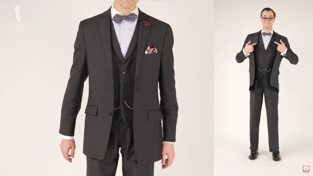 Preston wearing a waistcoat and it is a natural part of this three piece charcoal gray suit
