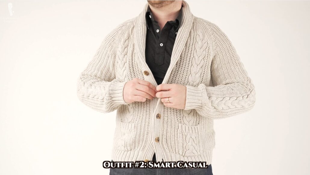 Nathan sports a polo shirt and a heavy cardigan for his smart casual look.