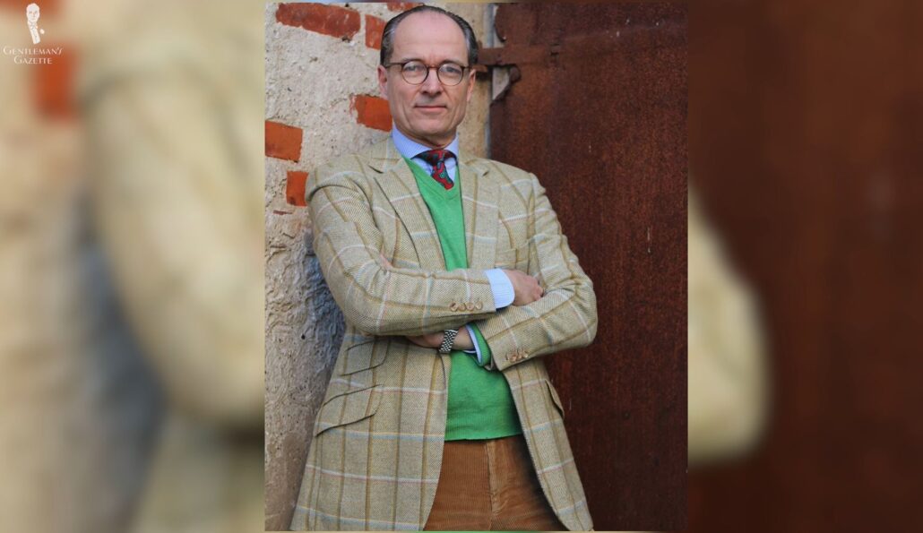 Eclectic but still classic, here Bernhard underlines his look with a bright green sweater