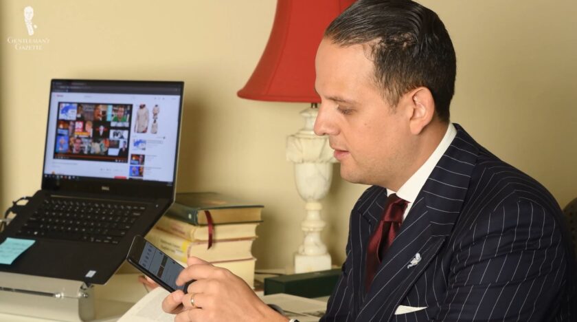 Having both a smartphone and a laptop helps Raphael manage his online business.