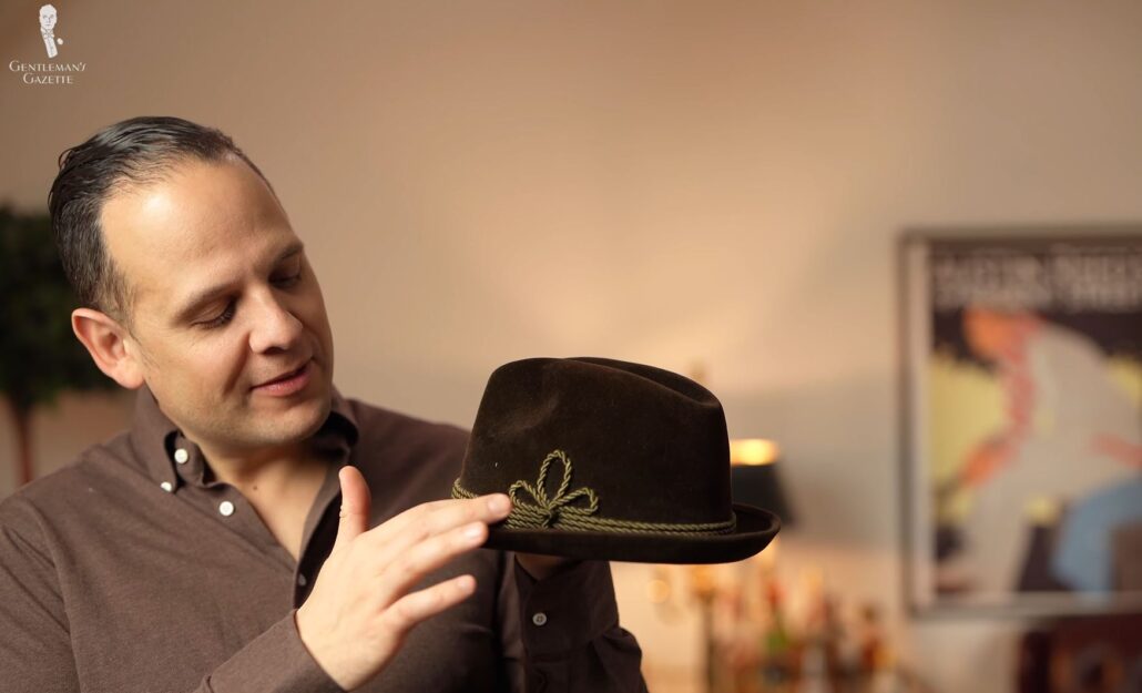 Raphael points out the green ribbon on a velour-finish Bavarian hat