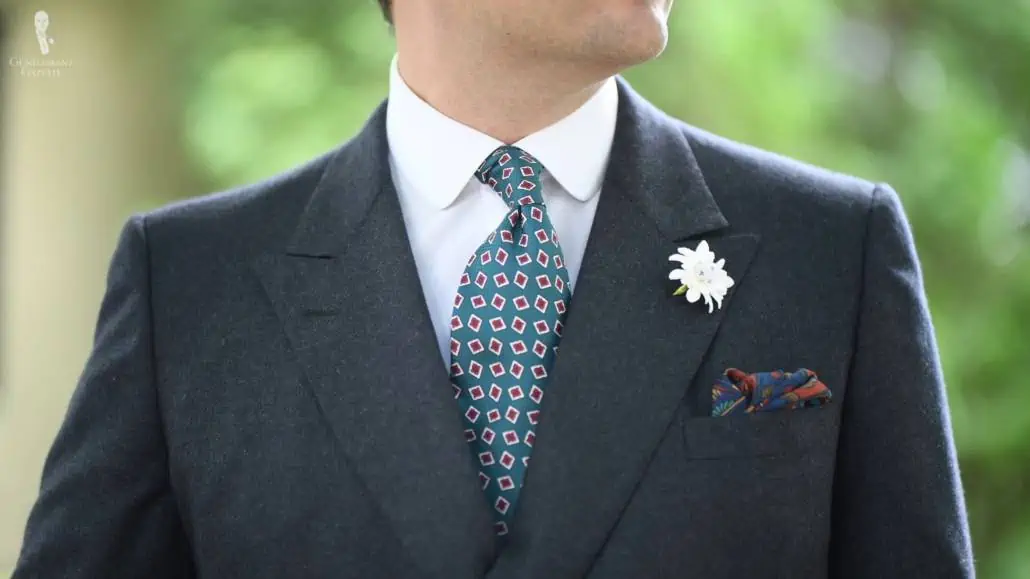A dark gray flannel suit jacket livened up with colors from Fort Belvedere accessories.
