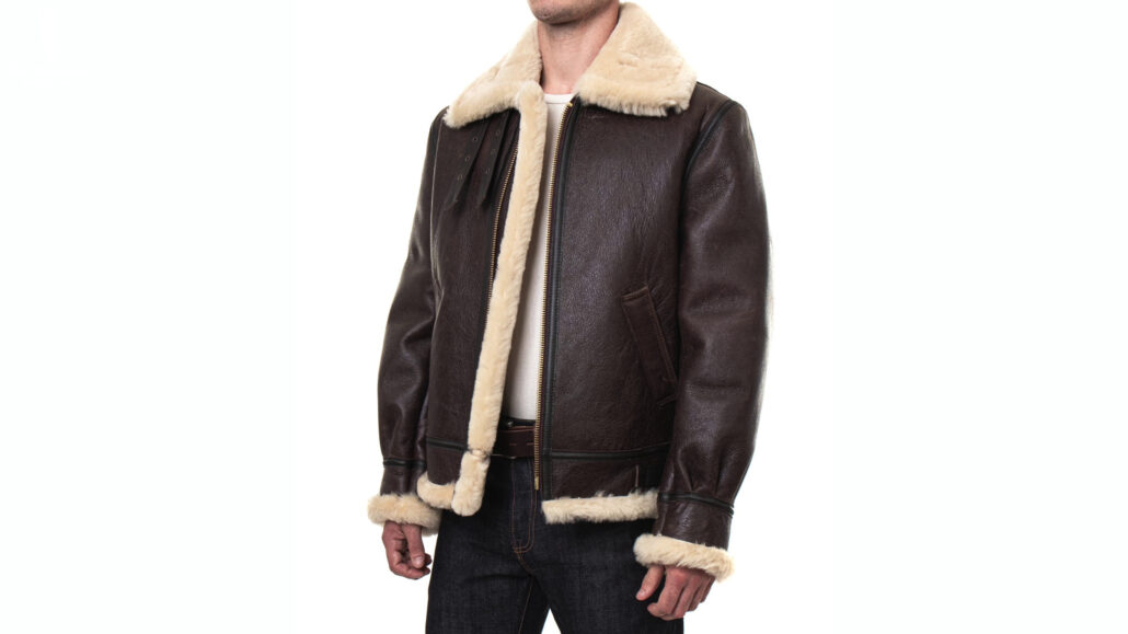 A gentleman wearing a B-3 Sheepskin Leather Bomber Jacket from Schott NYC, a leather jacket with an insulating lining