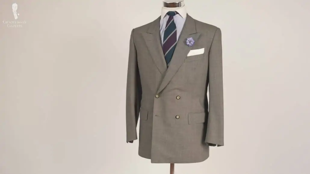 A gray suit style in a birdseye weave with a Winchester shirt with a very subtle herringbone pattern and a blue body