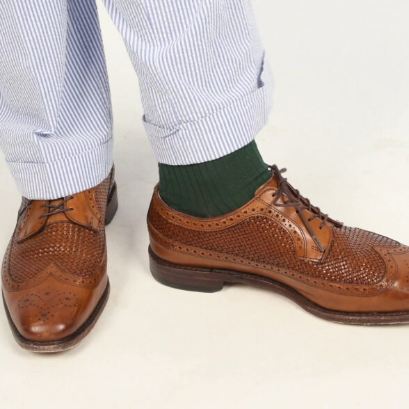 A pair of woven leather dress shoes.