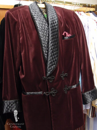 A photograph of a burgundy smoking jacket