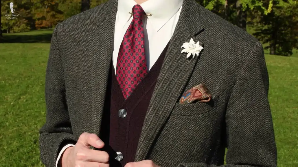 For layers, you can pair a tweed sport coat and a sweater or cardigan with a touch of red along with your white shirt.