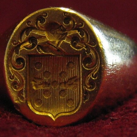 A photograph of a gold signet ring