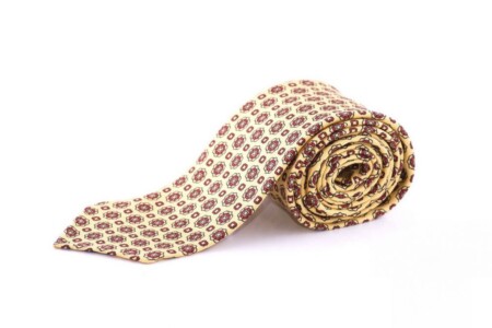 A bright yellow tie with a red pattern 