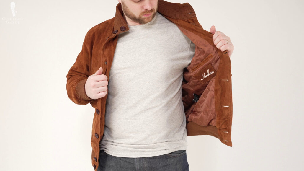 Nathan wearing a brown jacket