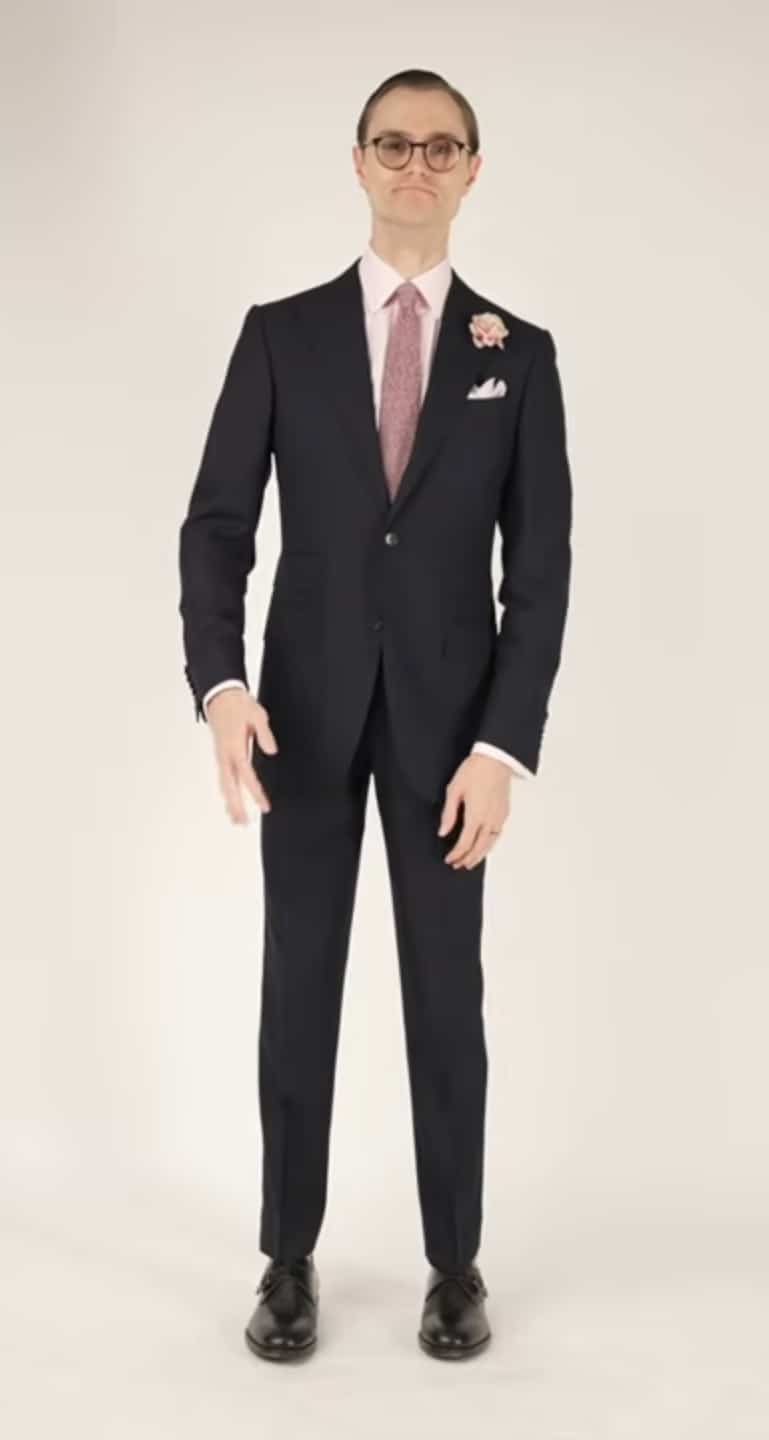 Preston wearing a cocktail attire suit with bright and colorful accessories