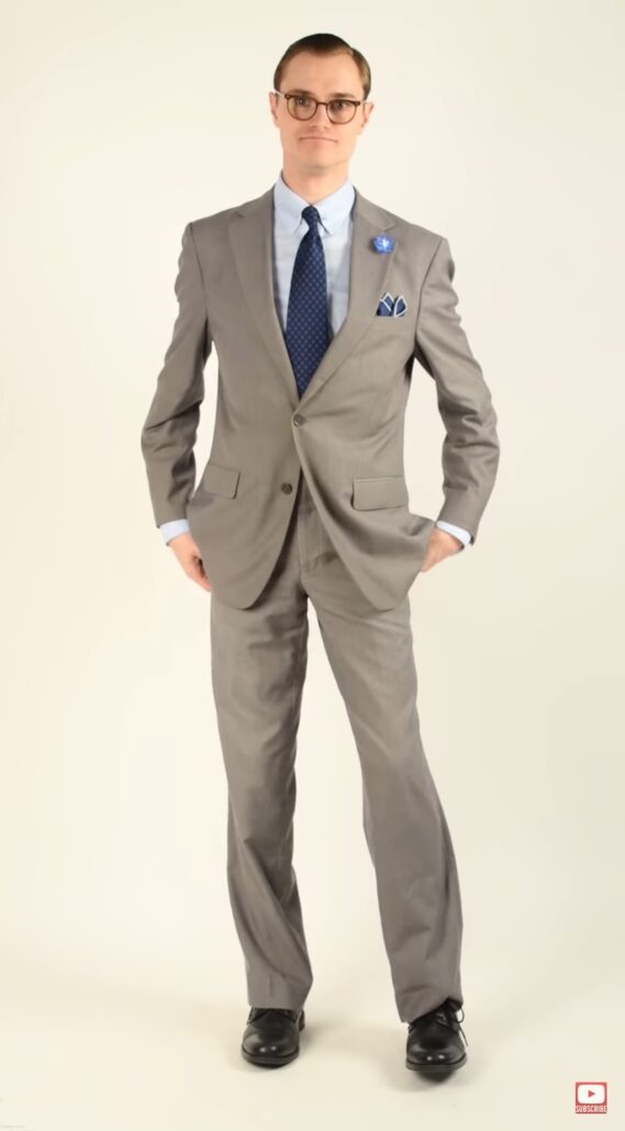 Preston in a medium gray suit with dark accessories 
