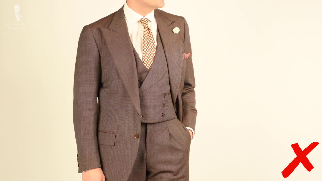 Raphael wearing a three-piece suit.