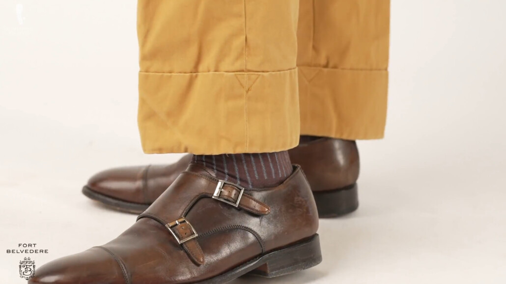 Raphael's pants have a three-inch cuff. He's wearing brown monk straps shoes from Shoepassion and tied the outfit together with a pair of brown and blue shadow stripe socks.