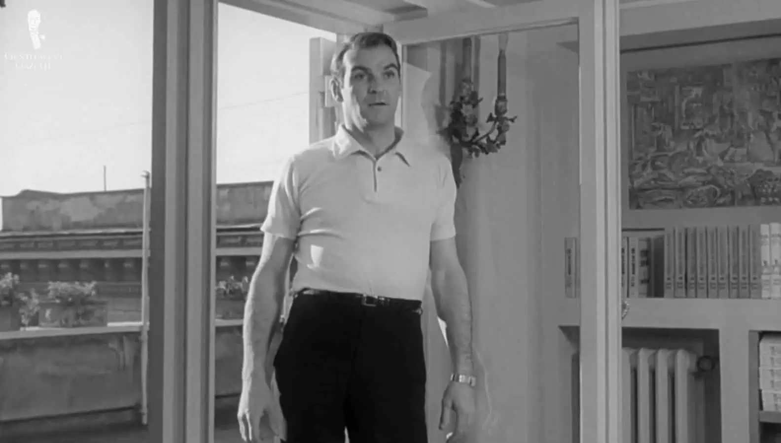 Stanley Baker in Eva (1962) wearing a polo shirt