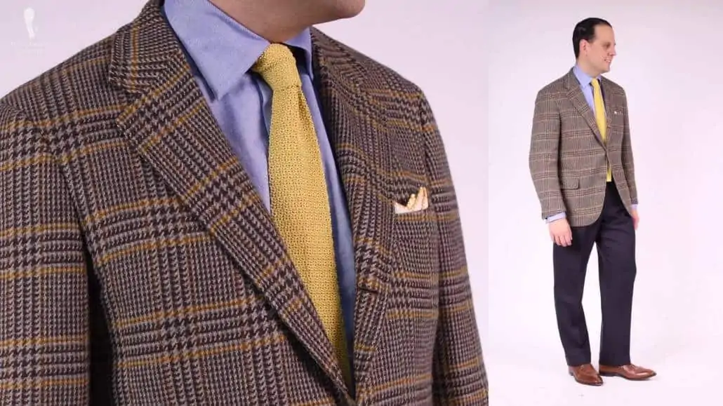 The yellow knit tie and light yellow pocket square complete the harmonious look of this ensemble.