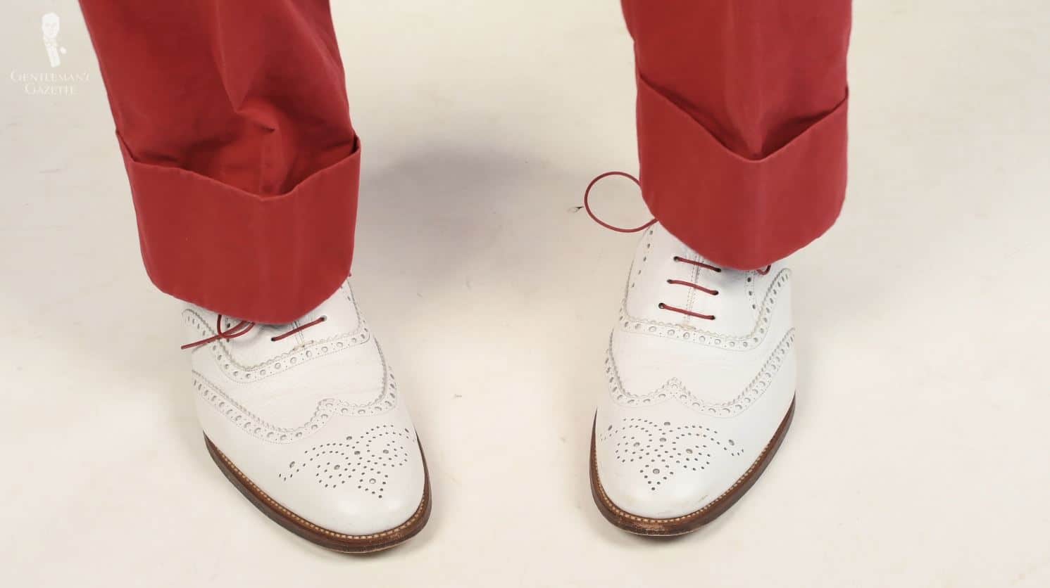White buck worn with red trousers and colored shoelaces