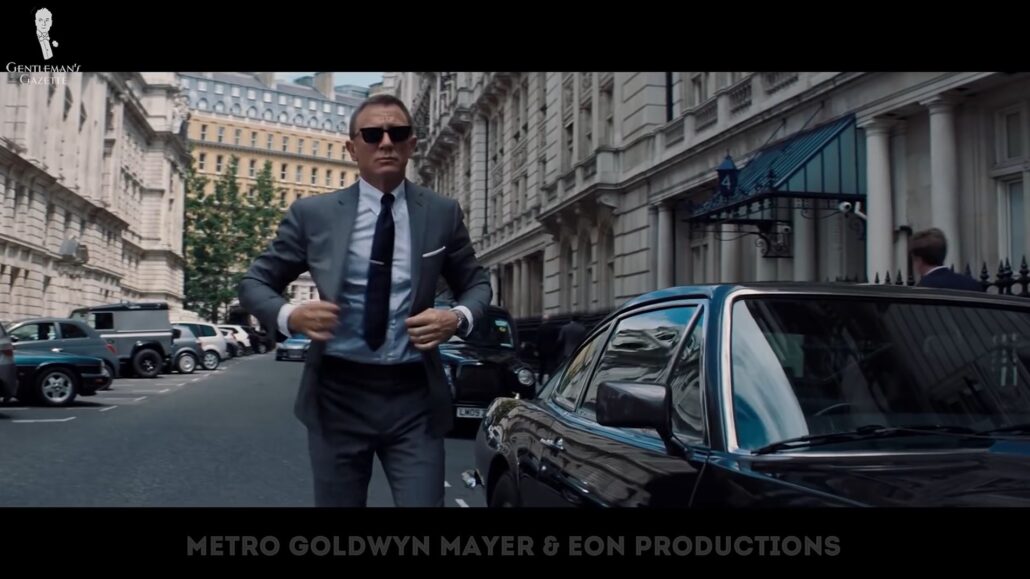 Bond in a classic gray suit [Image Credit: Metro Goldwyn Mayer and EON Productions]