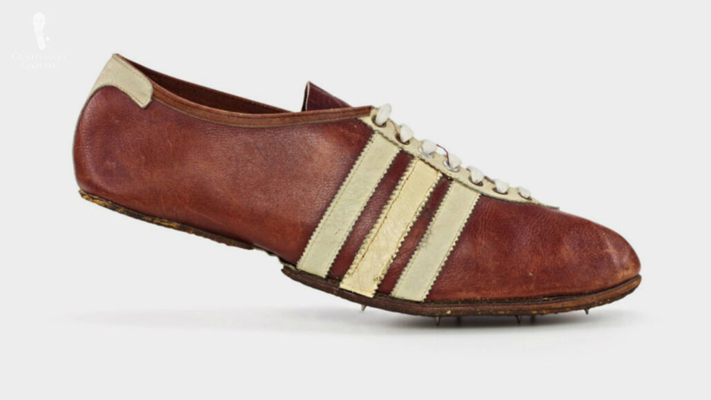 Brown leather shoes with white stripes on the side