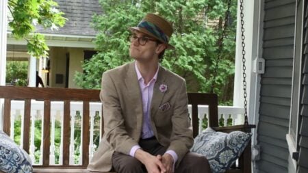 Preston Wearing A Tan Linen Jacket And A Pink Shirt Without A Tie Preston wearing a tan linen jacket and a pink shirt without a tie.